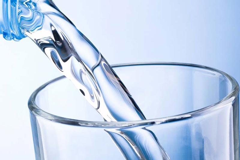 water being poured into a cup.